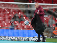 Lee Carsley, Interim Head Coach of England, participates in the pre-match warm-up during the UEFA Nations League Group 2 match between Engla...