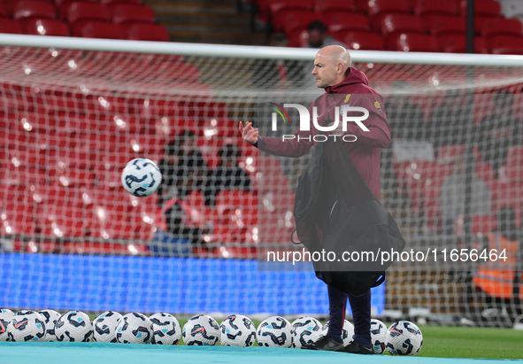 Lee Carsley, Interim Head Coach of England, participates in the pre-match warm-up during the UEFA Nations League Group 2 match between Engla...