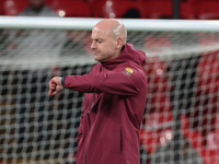 Lee Carsley, Interim Head Coach of England, participates in the pre-match warm-up during the UEFA Nations League Group 2 match between Engla...