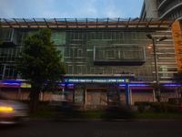 In Medan City, North Sumatra, Indonesia, on October 11, 2024, oil-fueled vehicles pass by an electric fuel filling station during a trial pe...