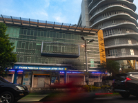 In Medan City, North Sumatra, Indonesia, on October 11, 2024, oil-fueled vehicles pass by an electric fuel filling station during a trial pe...