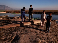 Kashmiri boys visit Wular Lake as a sightseeing location in Sopore, Jammu and Kashmir, India, on October 11, 2024. (