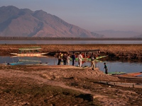 Kashmiri boys visit Wular Lake as a sightseeing location in Sopore, Jammu and Kashmir, India, on October 11, 2024. (