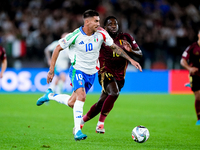 Lorenzo Pellegrini of Italy and Orel Mangala of Belgium compete for the ball during the UEFA Nations League 2024/25 League A Group A2 match...