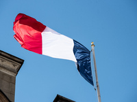 The French flag is above the Elysee Palace, home of President Emmanuel Macron, during the visit of Ukrainian President Volodymyr Zelensky in...