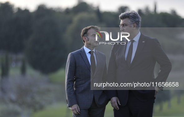 France's President Emmanuel Macron, left, and Prime Minister of Croatia Andrej Plenkovic talk on the sidelines of the MED9 leaders' summit a...