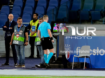 Referee Espen Eskas consults the pitch-side monitor after advice from the VAR during the UEFA Nations League 2024/25 League A Group A2 match...