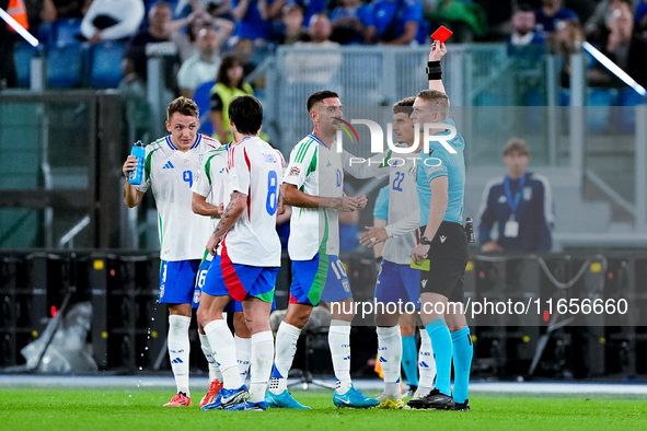 Referee Espen Eskas shows a red card to Lorenzo Pellegrini of Italy during the UEFA Nations League 2024/25 League A Group A2 match between I...