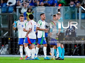 Referee Espen Eskas shows a red card to Lorenzo Pellegrini of Italy during the UEFA Nations League 2024/25 League A Group A2 match between I...