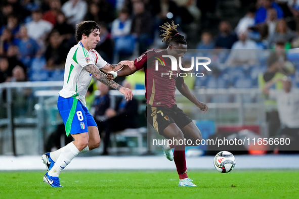 Jeremy Doku of Belgium and Sandro Tonali of Italy compete for the ball during the UEFA Nations League 2024/25 League A Group A2 match betwee...