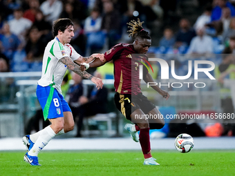 Jeremy Doku of Belgium and Sandro Tonali of Italy compete for the ball during the UEFA Nations League 2024/25 League A Group A2 match betwee...