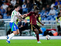 Jeremy Doku of Belgium and Sandro Tonali of Italy compete for the ball during the UEFA Nations League 2024/25 League A Group A2 match betwee...