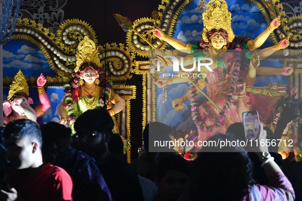 Hindu devotees visit a Puja Mandap during the Durga Puja festival in Dhaka, Bangladesh, on October 10, 2024. 