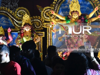 Hindu devotees visit a Puja Mandap during the Durga Puja festival in Dhaka, Bangladesh, on October 10, 2024. (