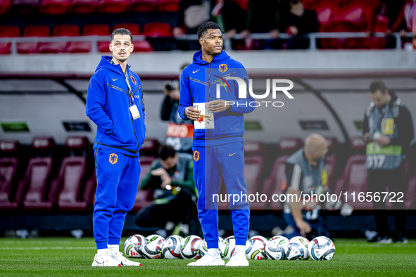 Netherlands goalkeeper Nick Olij and Netherlands defender Denzel Dumfries participate in the match between Hungary and the Netherlands at th...