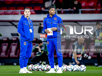 Netherlands goalkeeper Nick Olij and Netherlands defender Denzel Dumfries participate in the match between Hungary and the Netherlands at th...