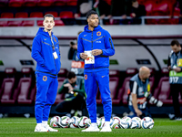 Netherlands goalkeeper Nick Olij and Netherlands defender Denzel Dumfries participate in the match between Hungary and the Netherlands at th...