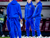 Netherlands midfielder Mats Wieffer and Netherlands defender Mickey van de Ven participate in the match between Hungary and the Netherlands...