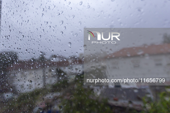 Raindrops are on a window during heavy rains in Lisbon, Portugal, on October 11, 2024. The national emergency and Civil Protection authority...