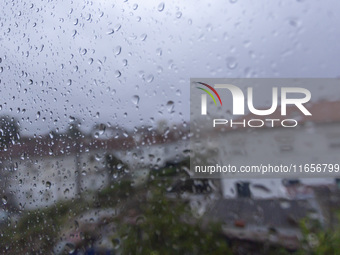 Raindrops are on a window during heavy rains in Lisbon, Portugal, on October 11, 2024. The national emergency and Civil Protection authority...