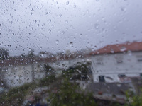 Raindrops are on a window during heavy rains in Lisbon, Portugal, on October 11, 2024. The national emergency and Civil Protection authority...