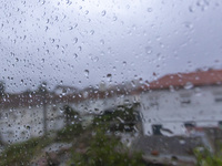 Raindrops are on a window during heavy rains in Lisbon, Portugal, on October 11, 2024. The national emergency and Civil Protection authority...