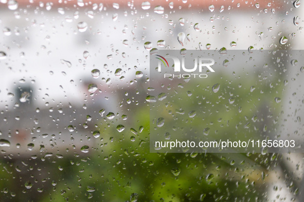 Raindrops are on a window during heavy rains in Lisbon, Portugal, on October 11, 2024. The national emergency and Civil Protection authority...