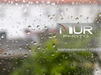 Raindrops are on a window during heavy rains in Lisbon, Portugal, on October 11, 2024. The national emergency and Civil Protection authority...