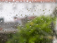 Raindrops are on a window during heavy rains in Lisbon, Portugal, on October 11, 2024. The national emergency and Civil Protection authority...