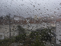 Raindrops are on a window during heavy rains in Lisbon, Portugal, on October 11, 2024. The national emergency and Civil Protection authority...