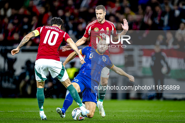 Hungary midfielder Dominik Szoboszlai, Netherlands defender Stefan de Vrij, and Hungary forward Barnabas Varga participate in the match betw...