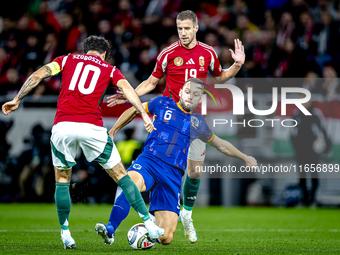 Hungary midfielder Dominik Szoboszlai, Netherlands defender Stefan de Vrij, and Hungary forward Barnabas Varga participate in the match betw...