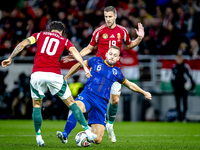 Hungary midfielder Dominik Szoboszlai, Netherlands defender Stefan de Vrij, and Hungary forward Barnabas Varga participate in the match betw...