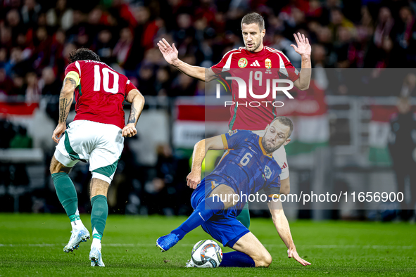 Hungary midfielder Dominik Szoboszlai, Netherlands defender Stefan de Vrij, and Hungary forward Barnabas Varga participate in the match betw...