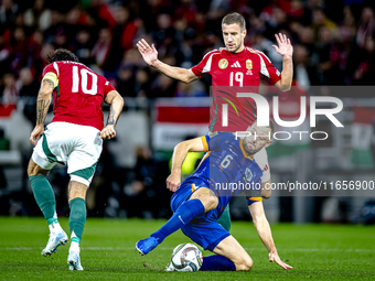 Hungary midfielder Dominik Szoboszlai, Netherlands defender Stefan de Vrij, and Hungary forward Barnabas Varga participate in the match betw...