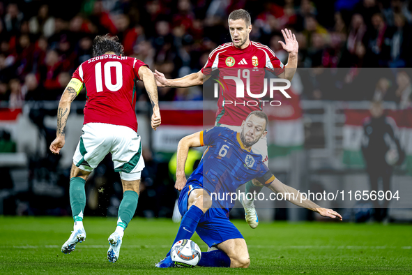 Hungary midfielder Dominik Szoboszlai, Netherlands defender Stefan de Vrij, and Hungary forward Barnabas Varga participate in the match betw...