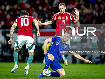 Hungary midfielder Dominik Szoboszlai, Netherlands defender Stefan de Vrij, and Hungary forward Barnabas Varga participate in the match betw...