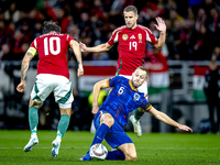 Hungary midfielder Dominik Szoboszlai, Netherlands defender Stefan de Vrij, and Hungary forward Barnabas Varga participate in the match betw...