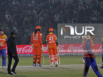 Chris Gayle (L) and Shikhar Dhawan (R) of Gujarat Greats participate in the Legends League Cricket T20 match between Gujarat Greats and Kona...