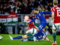 Hungary forward Roland Sallai, Netherlands midfielder Quinten Timber, and Netherlands defender Mickey van de Ven are present during the matc...