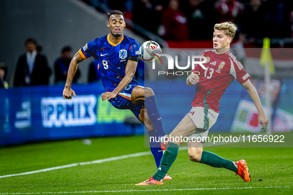 Netherlands midfielder Ryan Gravenberch and Hungary midfielder Andras Schafer play during the match between Hungary and the Netherlands at t...