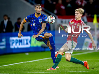 Netherlands midfielder Ryan Gravenberch and Hungary midfielder Andras Schafer play during the match between Hungary and the Netherlands at t...