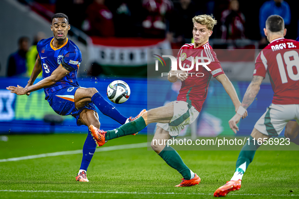 Netherlands midfielder Ryan Gravenberch and Hungary midfielder Andras Schafer play during the match between Hungary and the Netherlands at t...