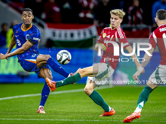 Netherlands midfielder Ryan Gravenberch and Hungary midfielder Andras Schafer play during the match between Hungary and the Netherlands at t...