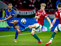 Netherlands midfielder Ryan Gravenberch and Hungary midfielder Andras Schafer play during the match between Hungary and the Netherlands at t...