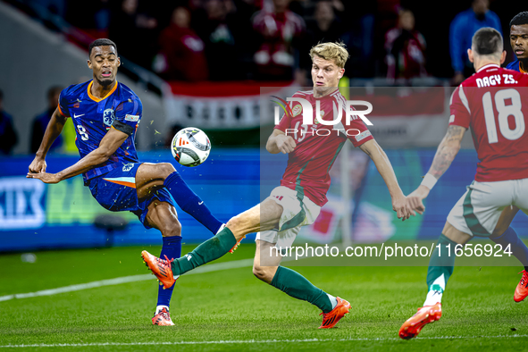 Netherlands midfielder Ryan Gravenberch and Hungary midfielder Andras Schafer play during the match between Hungary and the Netherlands at t...