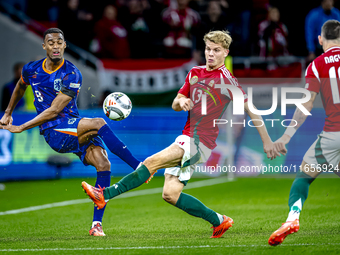 Netherlands midfielder Ryan Gravenberch and Hungary midfielder Andras Schafer play during the match between Hungary and the Netherlands at t...