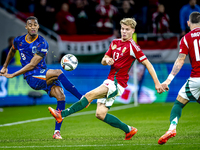 Netherlands midfielder Ryan Gravenberch and Hungary midfielder Andras Schafer play during the match between Hungary and the Netherlands at t...