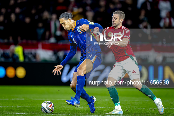 Netherlands defender Virgil van Dijk and Hungary forward Barnabas Varga play during the match between Hungary and the Netherlands at the Pus...