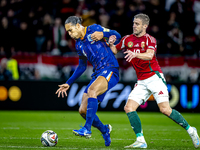 Netherlands defender Virgil van Dijk and Hungary forward Barnabas Varga play during the match between Hungary and the Netherlands at the Pus...